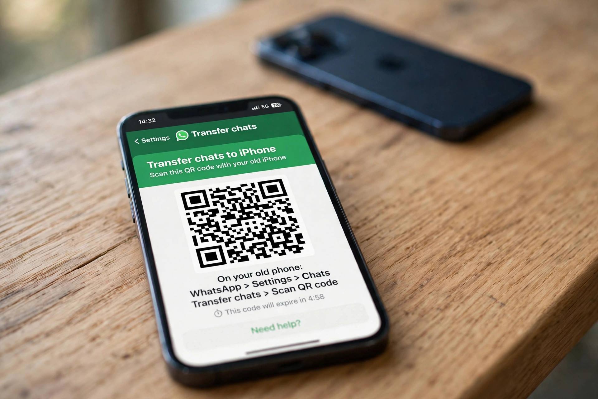Close-up of a QR code displayed on an iPhone screen for WhatsApp chat transfer