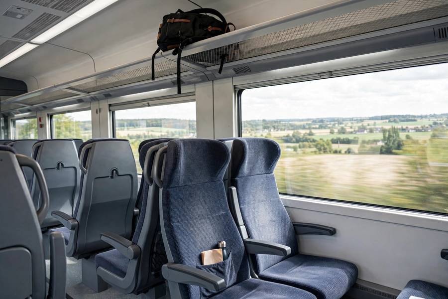 Inside a European intercity train — comfortable second-class seats are the standard Eurail experience