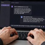 Writing a detailed work prompt on a laptop for better AI results