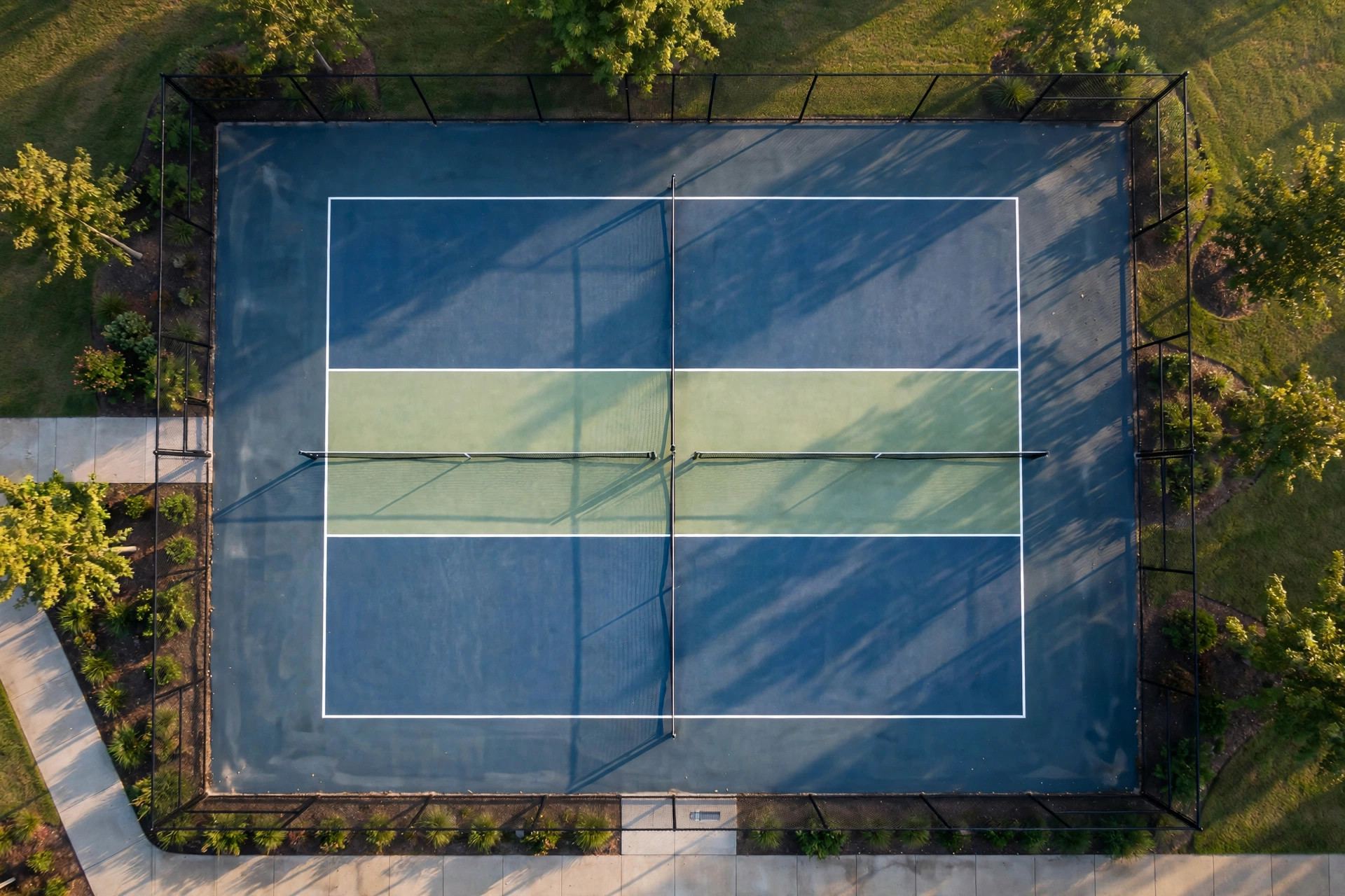 Overhead view of a pickleball court with the non-volley kitchen zone marked