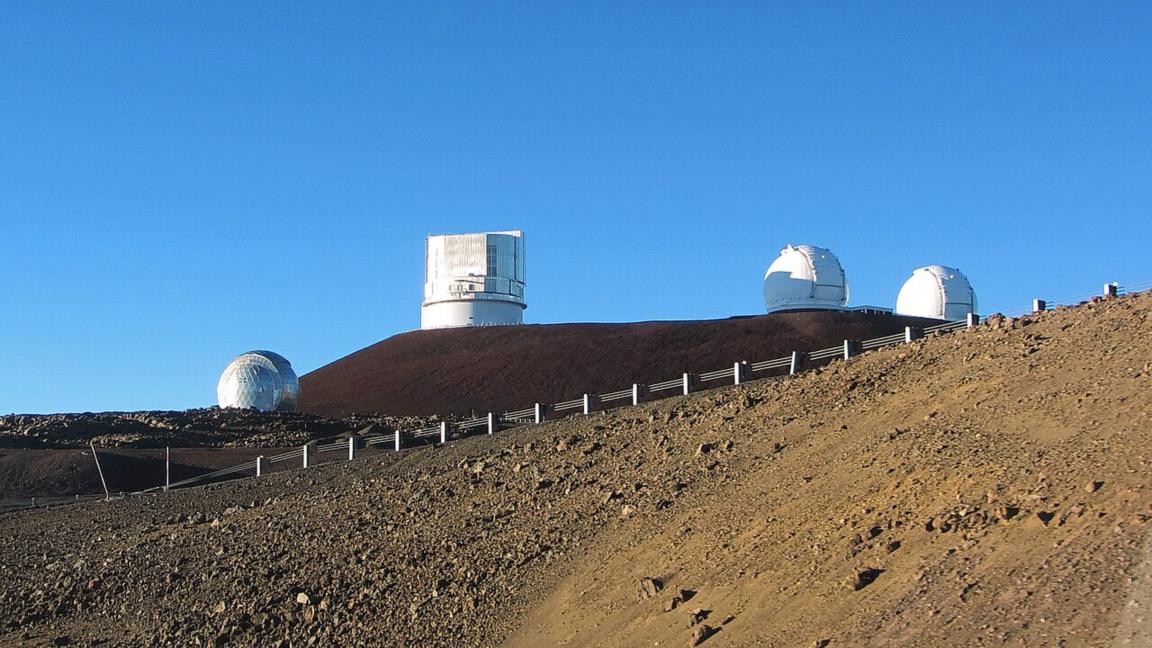 Telescope domes on the summit of Mauna Kea, Hawaii, a contender for the world's tallest volcano measured from its base