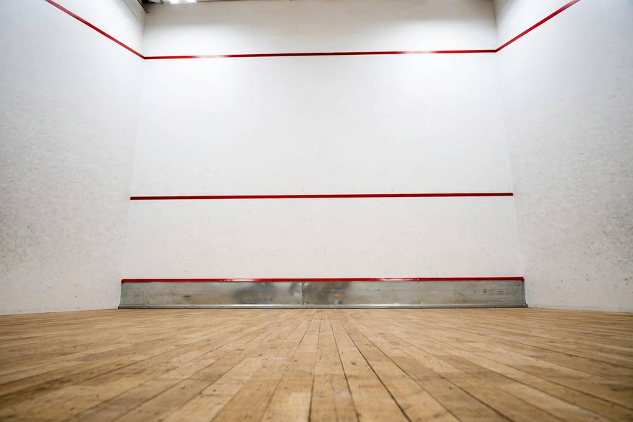 Squash court front wall showing out line, service line, and tin height