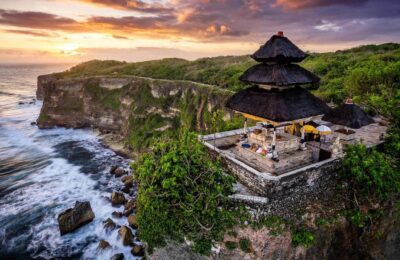 Uluwatu Temple on a cliff at sunset, one of the essential things to do in Bali