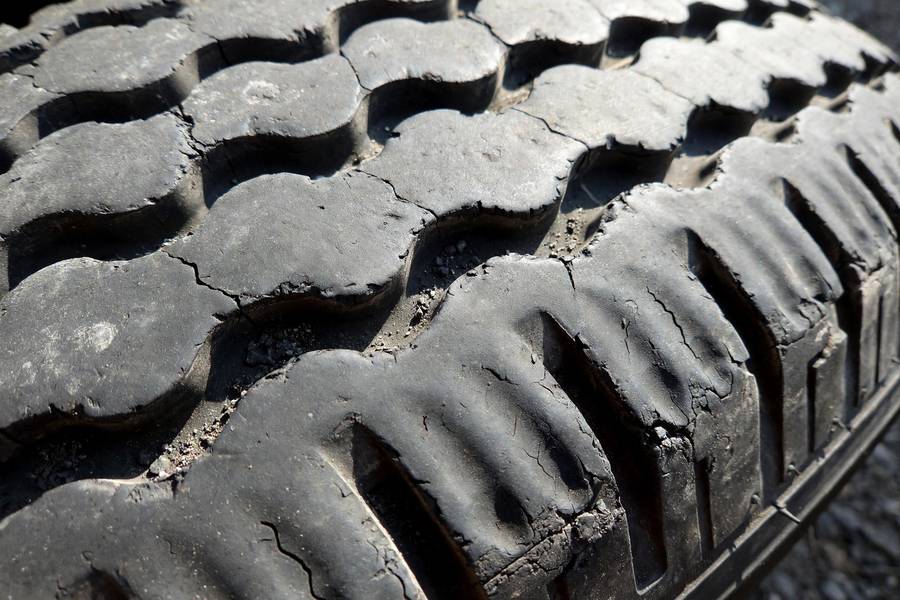 Cupped tire wear pattern from suspension and balance issues