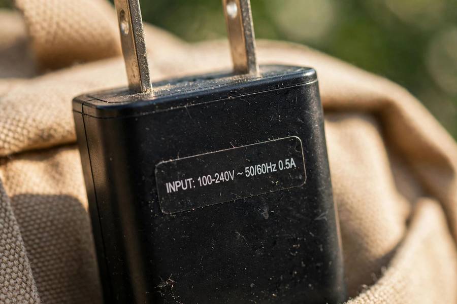 Close up of dual voltage label on charger 100-240V