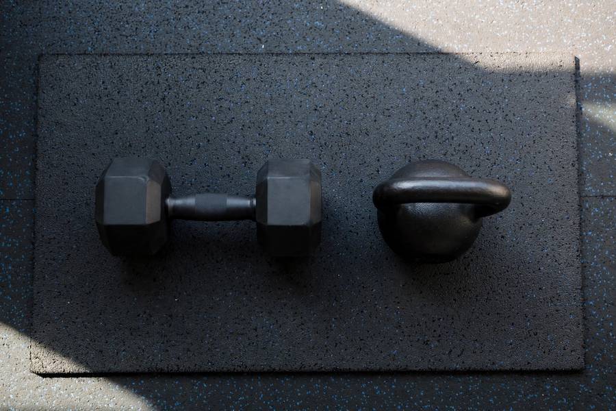 Kettlebell and dumbbell equipment options for Turkish get-up training
