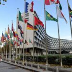 UNESCO AI Ethics: The Global Recommendation Explained International headquarters building with flags representing UNESCO