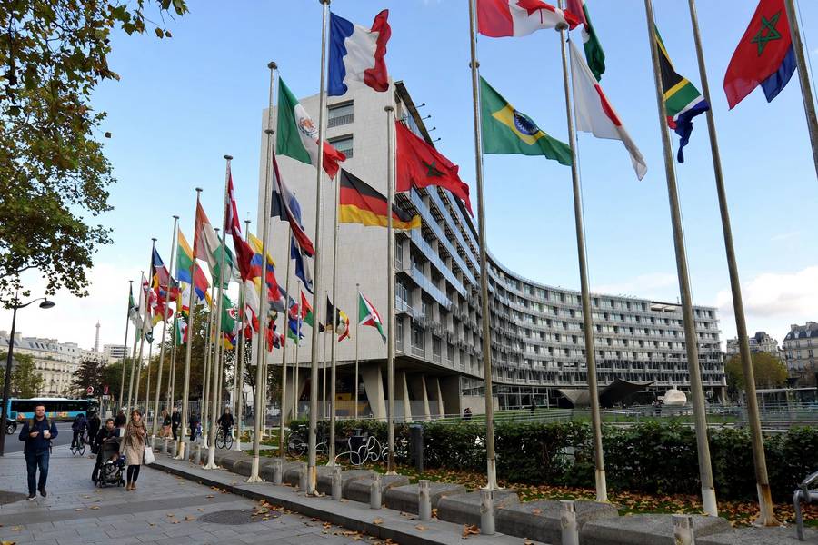 International headquarters building with flags representing UNESCO