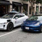 Waymo vs Tesla: Two Visions of Self-Driving Cars Waymo robotaxi beside a Tesla illustrating Waymo vs Tesla