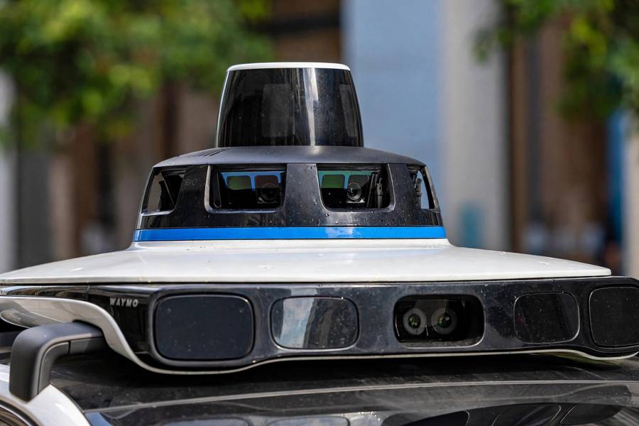 Waymo roof sensor dome in the Waymo vs Tesla comparison