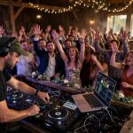 Wedding DJ vs Band: How to Decide A wedding DJ keeping the dance floor packed — the wedding DJ vs band decision shapes the whole reception
