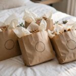 Wedding Welcome Bag Ideas: 15 Thoughtful Fillers Wedding welcome bags on a hotel bed — thoughtful wedding welcome bag ideas for out-of-town guests