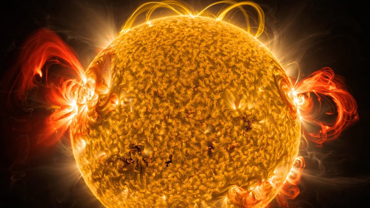 wide landscape of the Sun with visible coronal loops