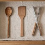 Open kitchen drawer showing minimal curated cooking tools
