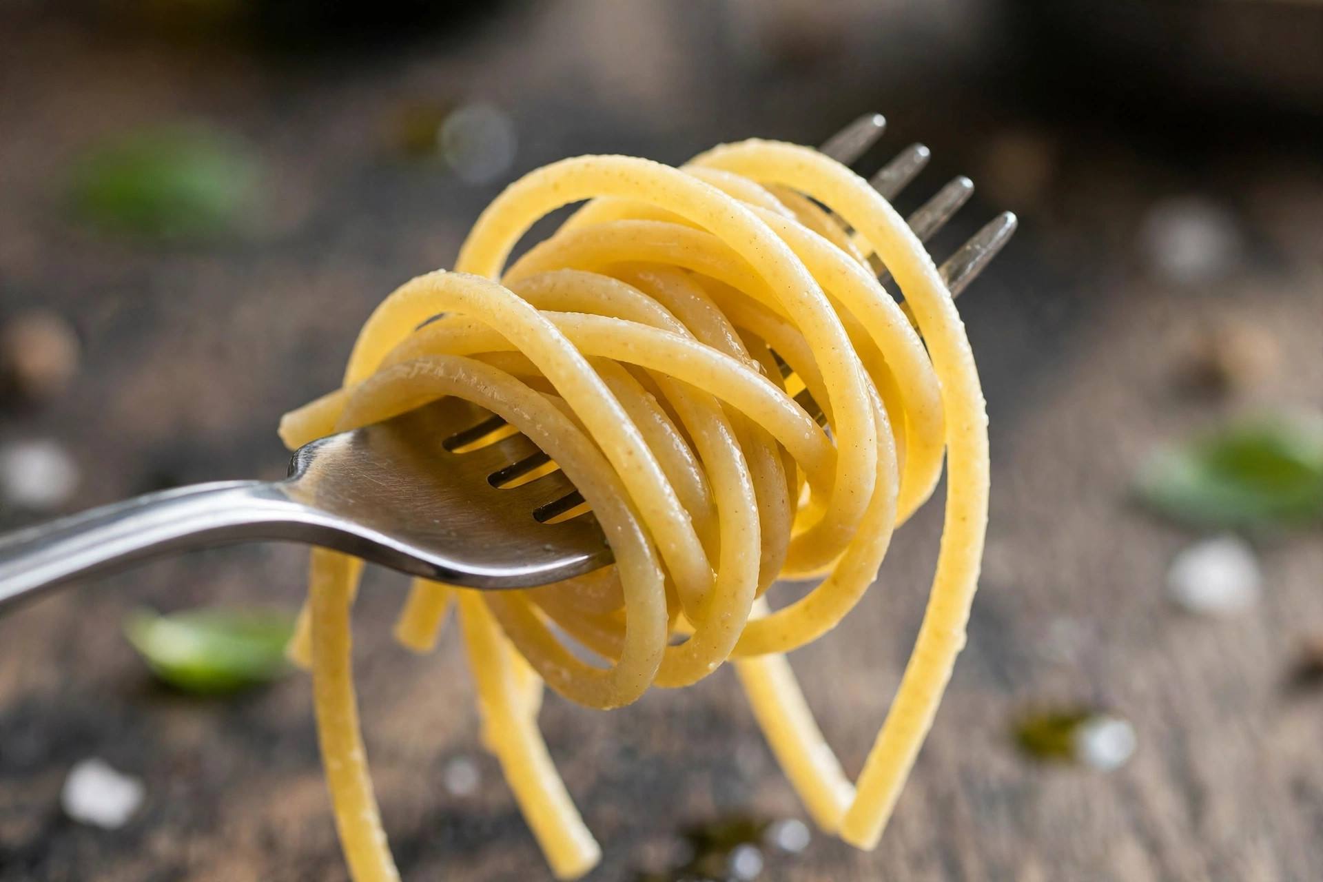 Perfectly cooked al dente pasta being twirled on a fork