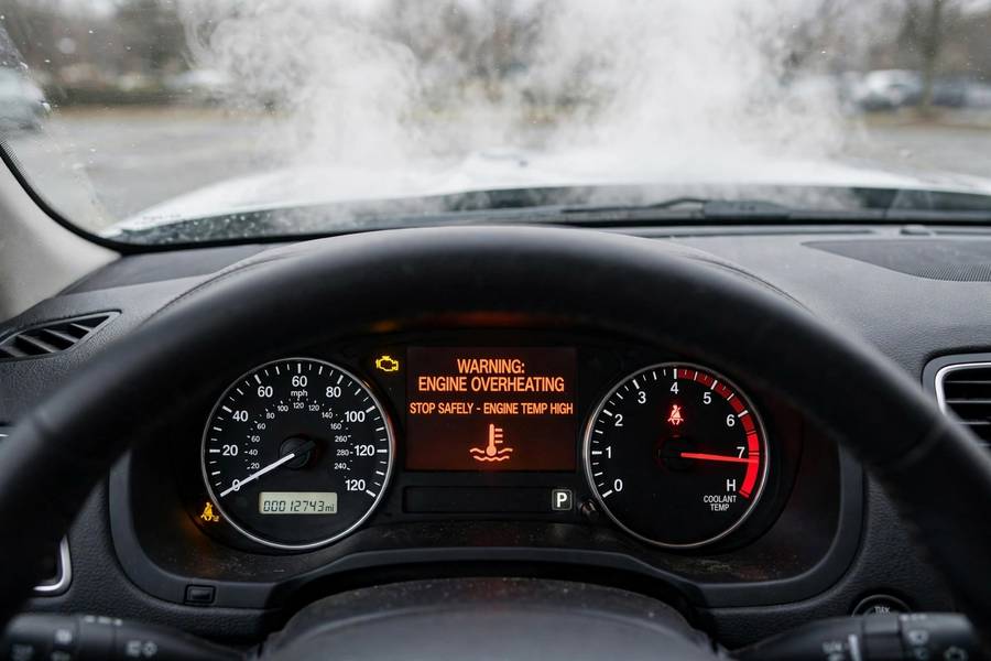 Overheating dashboard warning showing what happens when coolant fails, related to what does coolant do in a car
