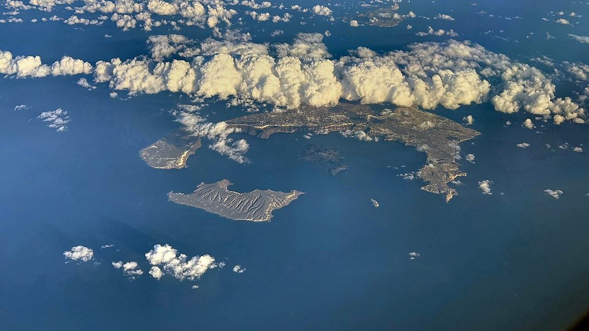 The flooded caldera of Santorini in Greece, seen from the air with its ring of islands