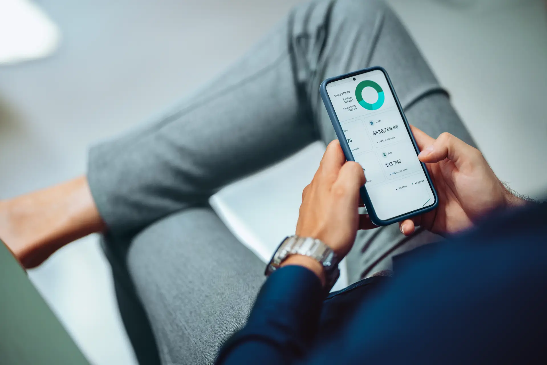 A person reviewing a personal finance app on their phone