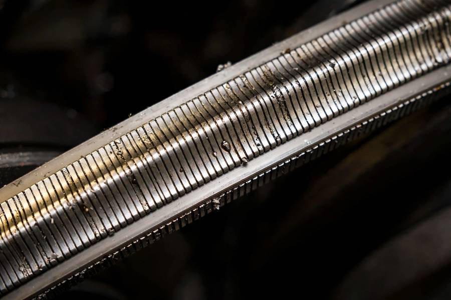 Close-up of a steel CVT belt, the key component explained in what is a CVT transmission