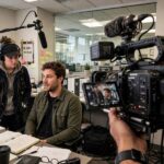 What Is a Mockumentary? Definition, Examples & Why They Work Mockumentary film set with a documentary-style interview being filmed