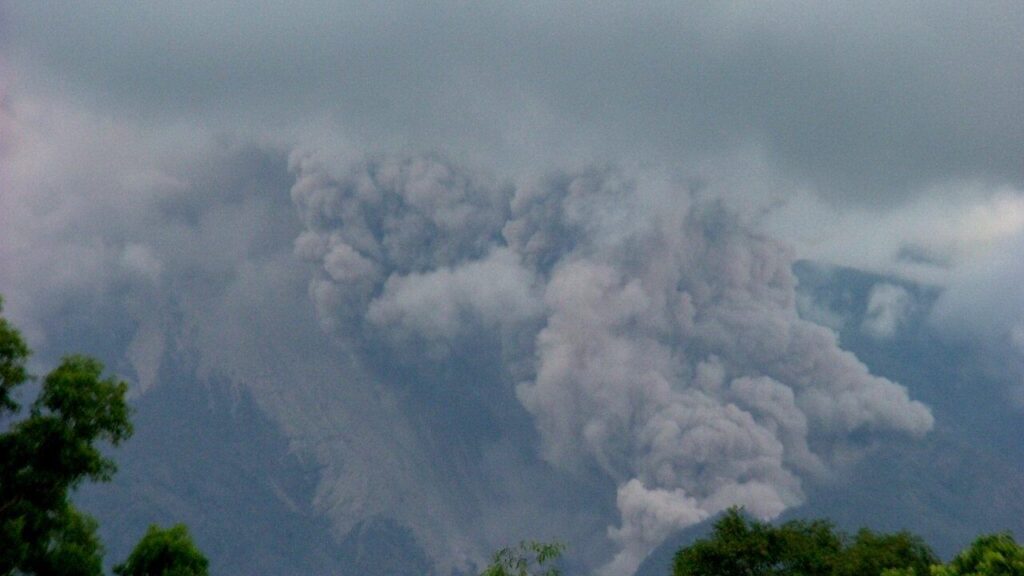 A pyroclastic flow of hot ash and gas rolling down the slopes of Mount Merapi, Indonesia
