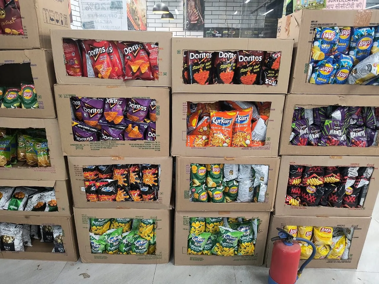 A row of branded product packaging lined up on a shelf