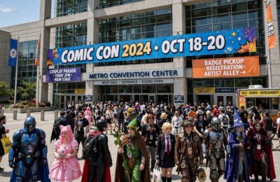 Crowds of fans entering a comic convention center