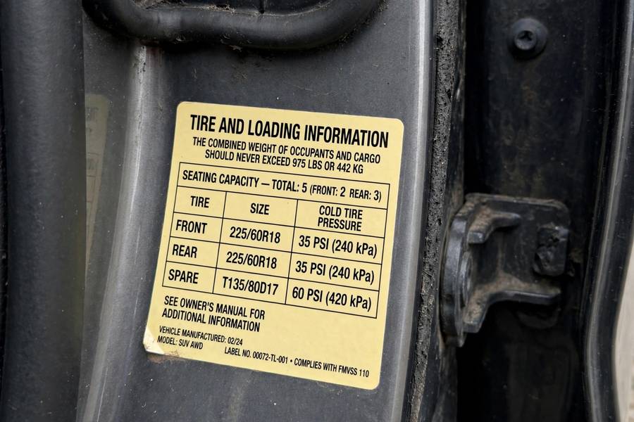 Door jamb placard showing what is correct tire pressure PSI for the vehicle