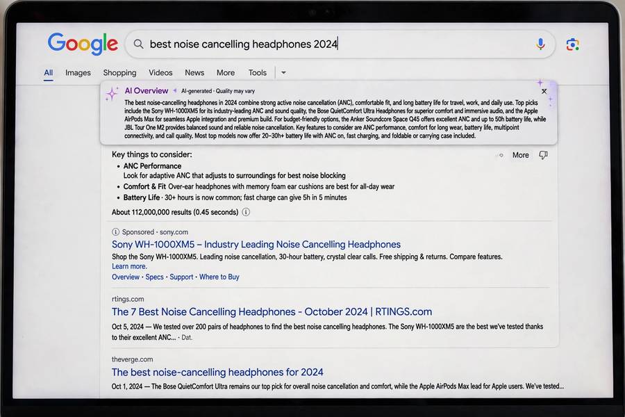 Google AI Mode overview box at the top of search results on a laptop