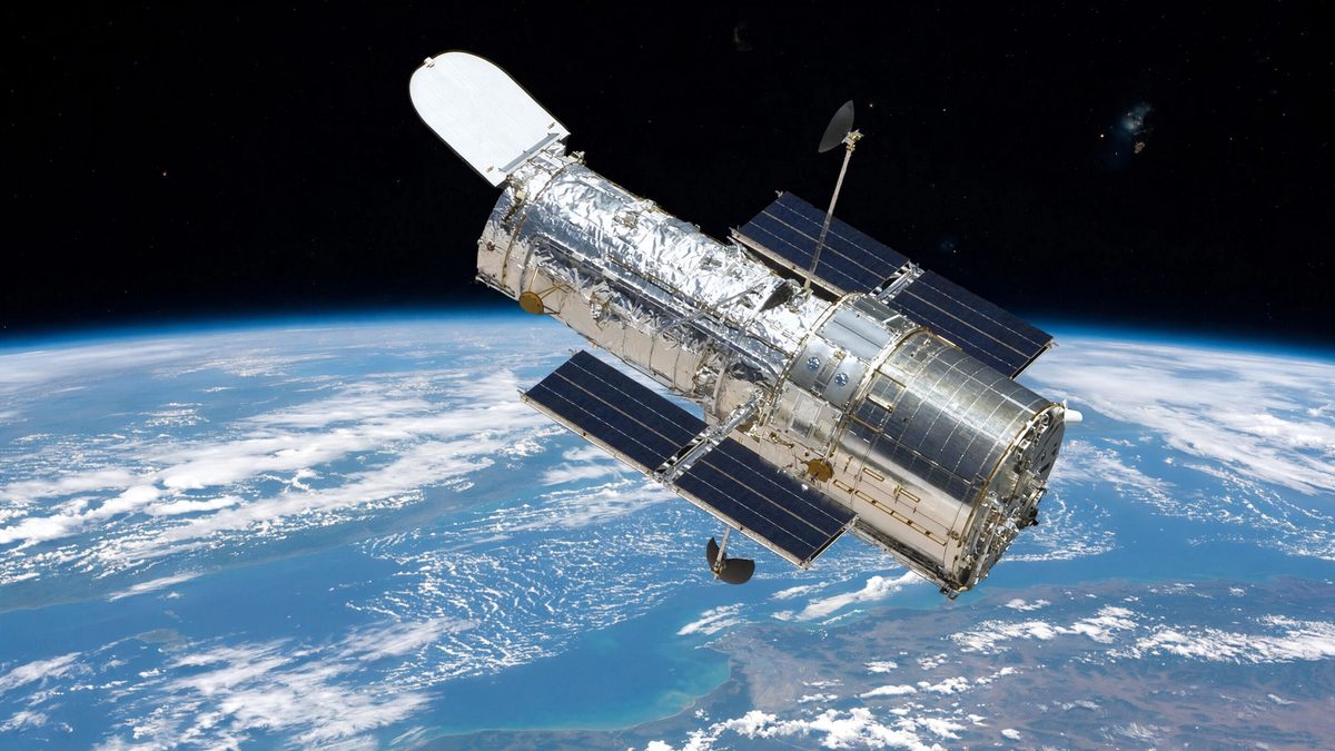 the Hubble Space Telescope in orbit above Earth