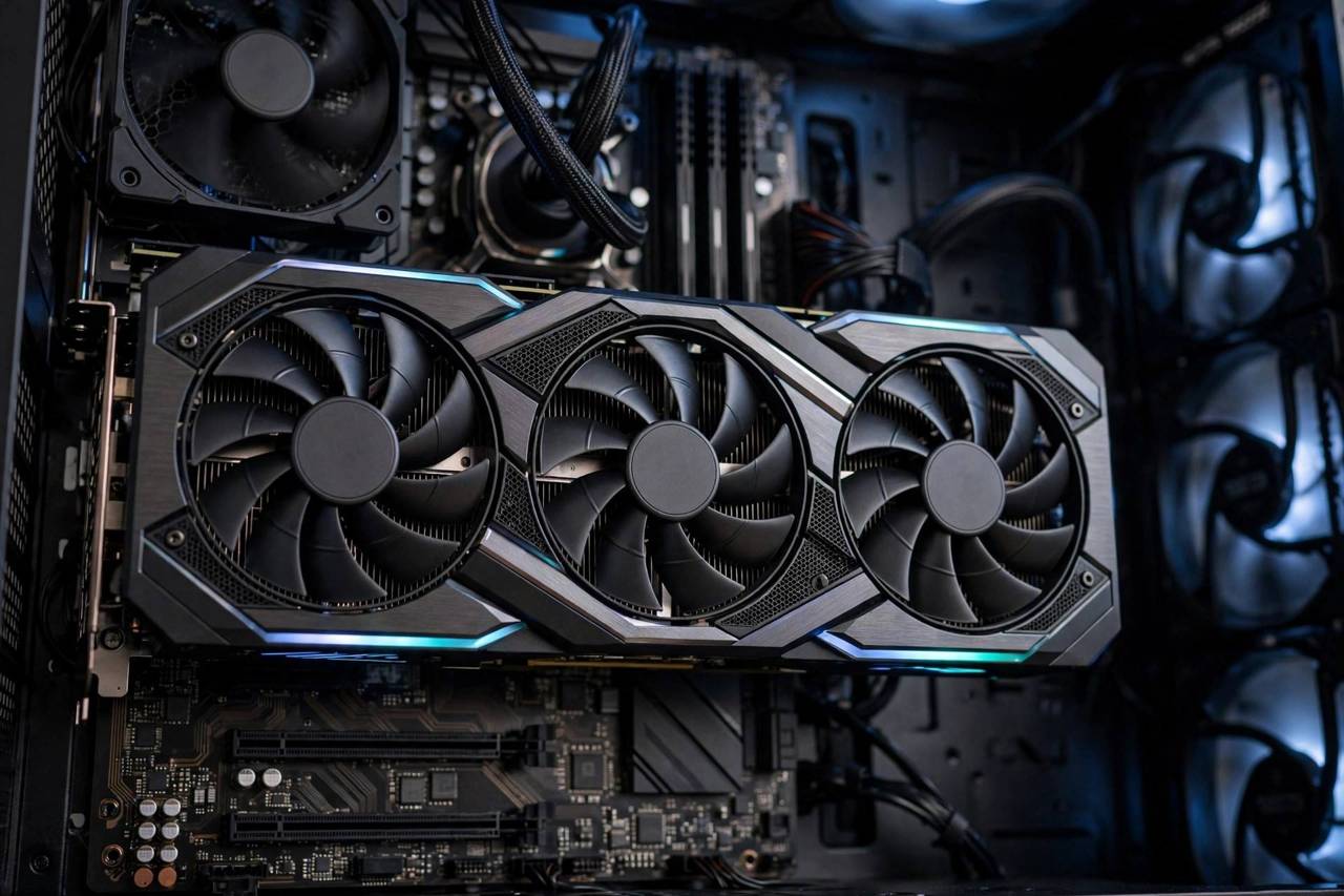 Close-up of a modern graphics card installed in a gaming PC with cooling fans