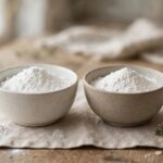What Is the Difference Between Baking Soda and Powder? Baking soda and baking powder in bowls side by side