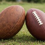 What Is the Difference Between Rugby and American Football? Rugby ball and American football side by side