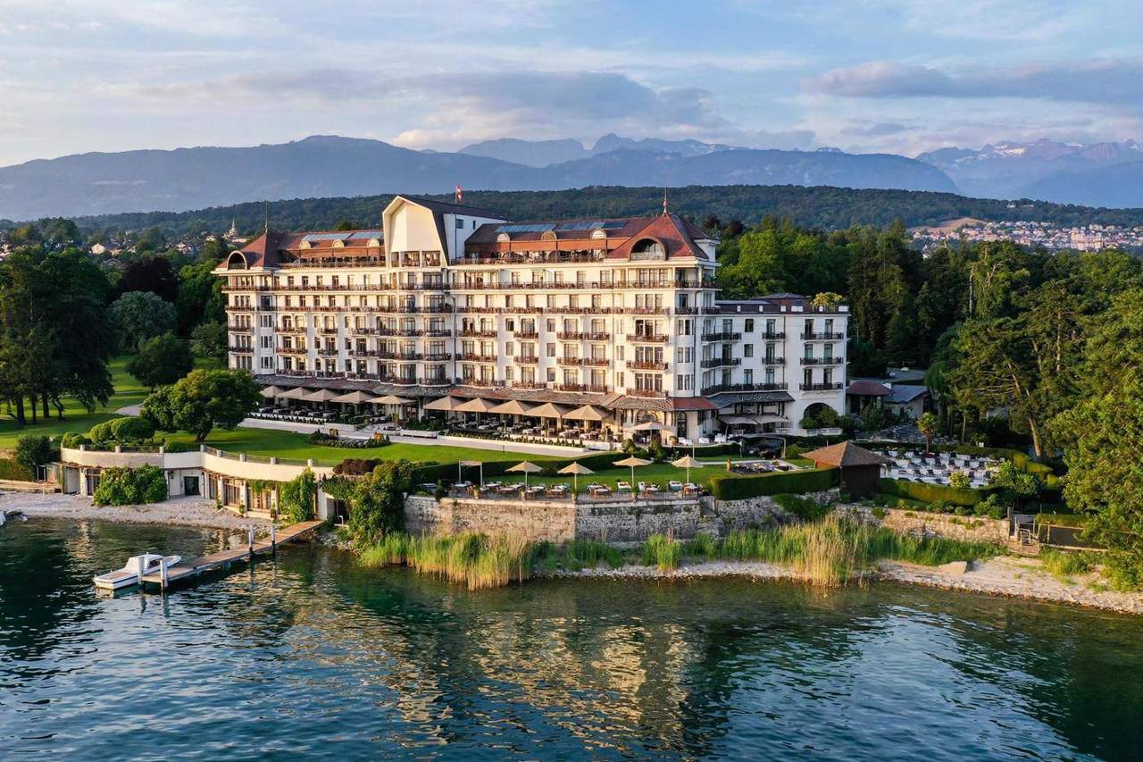 Lakeside view of Évian-les-Bains France with the historic Hôtel Royal on the shore of Lake Geneva