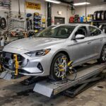 What Is Wheel Alignment? Camber, Caster, Toe Explained Car on an alignment rack showing what is wheel alignment service in practice