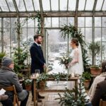 Winter Wedding Ideas: 20 Ways to Make It Magical A conservatory winter wedding with snow falling outside — magical winter wedding ideas for cold-weather celebrations