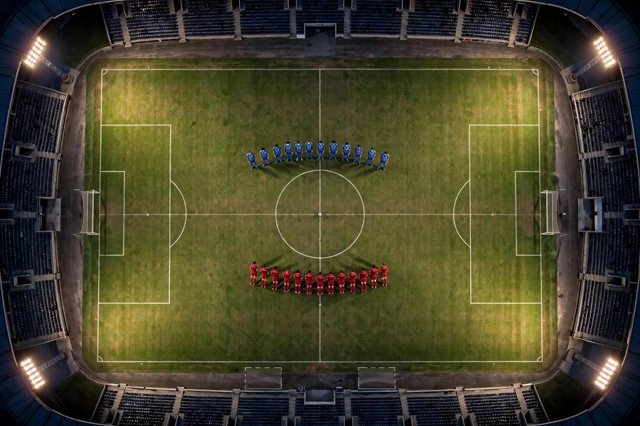 Close contest for the ball during a World Cup group game
