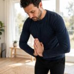 Wrist Stretches for Handstands: The 10-Minute Prep That Saves Wrists Person doing prayer stretch for wrists before handstand practice